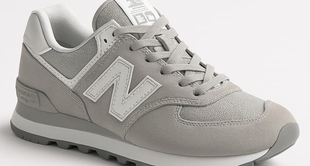alt="New Balance 550 sneakers styled with streetwear outfit 2025"