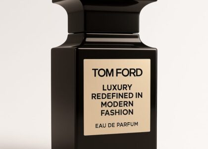 Tom Ford wearing a black tuxedo on the red carpet, showcasing his signature elegant style.