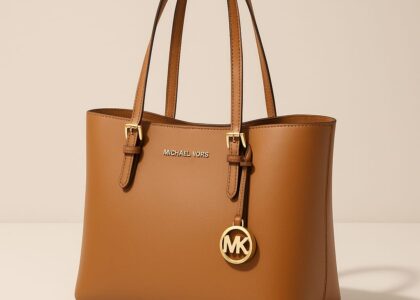 Michael Kors branded packaging including gift boxes and shopping bags, representing the brand’s luxury identity.