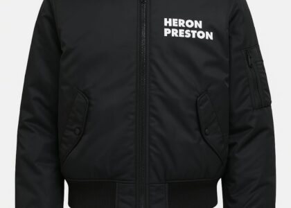 Model wearing Heron Preston streetwear featuring the signature orange tag and Cyrillic graphics