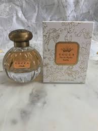 Lifestyle image – “Woman wearing Tocca perfumes for everyday elegance.”