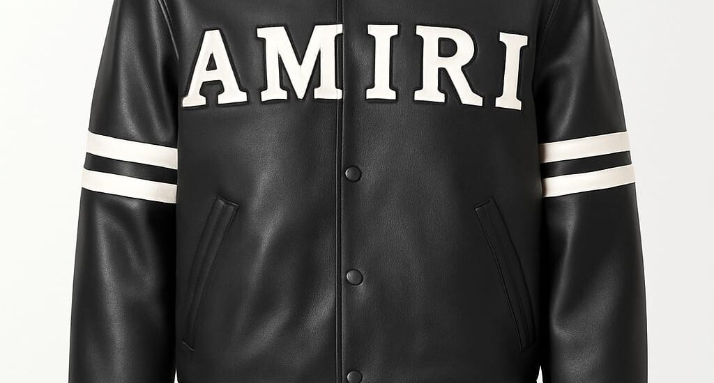 A black and gold Amiri jacket styled with ripped denim, showcasing the brand’s luxury-meets-streetwear essence.
