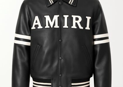 A black and gold Amiri jacket styled with ripped denim, showcasing the brand’s luxury-meets-streetwear essence.