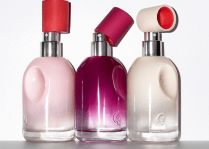 Glossier You perfume bottles on a minimalist vanity