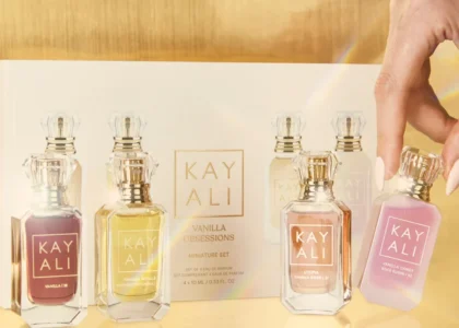 Kayali perfume bottles displayed elegantly on a vanity with soft lighting.