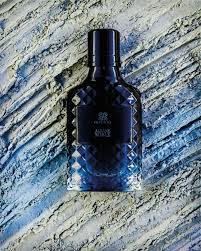 Elegant bottle of Parisis Parfums on a luxury vanity table