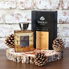 Flat lay of Yardley London fragrances on a wooden vanity table